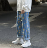 Pantalones vaqueros con estampado de girasoles